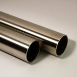 Side view of two 304 stainless steel round tubes cut to length showing satin polished surface