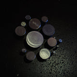 Angled view of stainless steel round bar cut sections showing end faces and range of available diameters