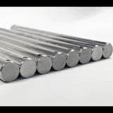 Multiple 316 stainless steel boat trailer roller spindles fanned out showing split pin holes