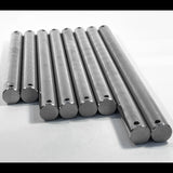 Multiple 316 stainless steel boat trailer roller spindles stacked at an angle on white background