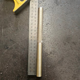 brass drift with knurled handle on a steel bench