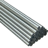 Large bundle of stainless steel round bar cut to length stacked at angle showing polished end faces on white background