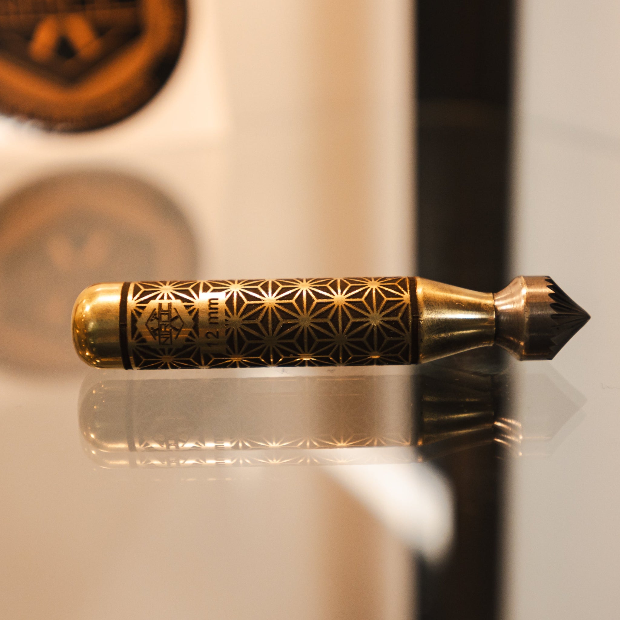12mm deburring tool with kumiko engravings on the body and a carbide tip