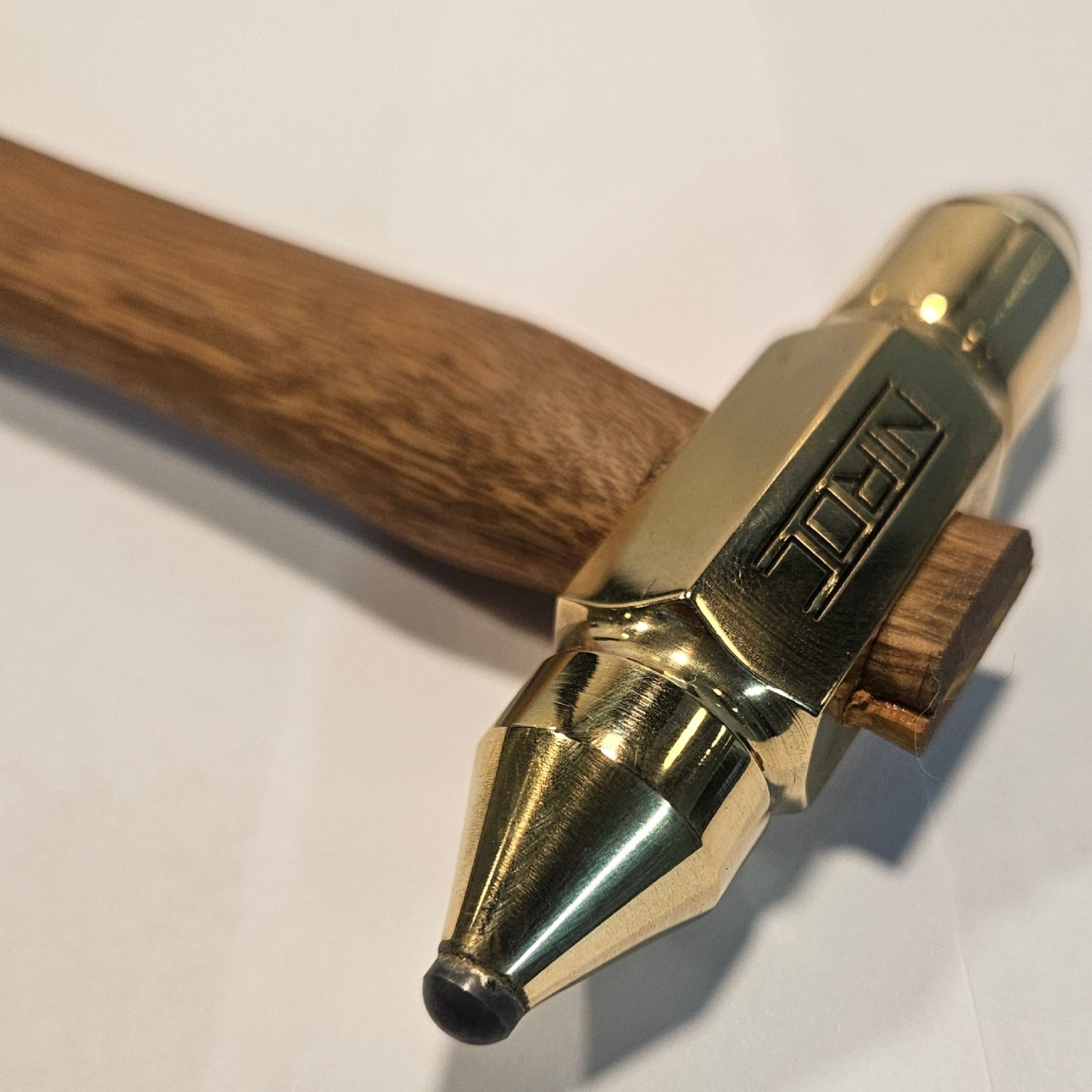 small brass head hammer with rounded carbide faces of different diameters for tig welders or alike  