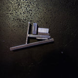 Stainless steel flat bar cut sections showing range of available widths and thicknesses on dark background