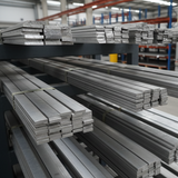 Stacks of aluminium flat bars in a warehouse setting stacked on a rack