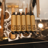 A set of 5 blackened brass pin punches with star pattern handles