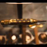 polished brass with kumiko pattern engraved into the body of this auto punch with a carbide tip